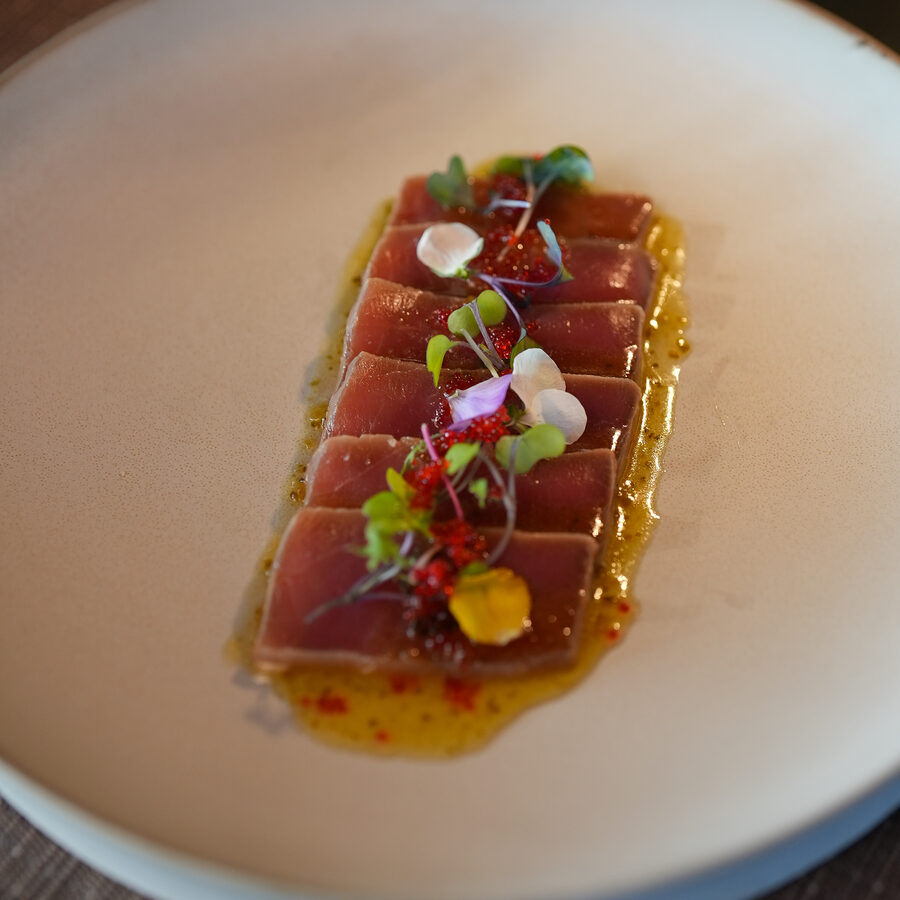 Seared tuna tataki on a rectangular plate